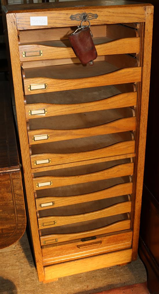 Oak tambour front 9 shelf cabinet